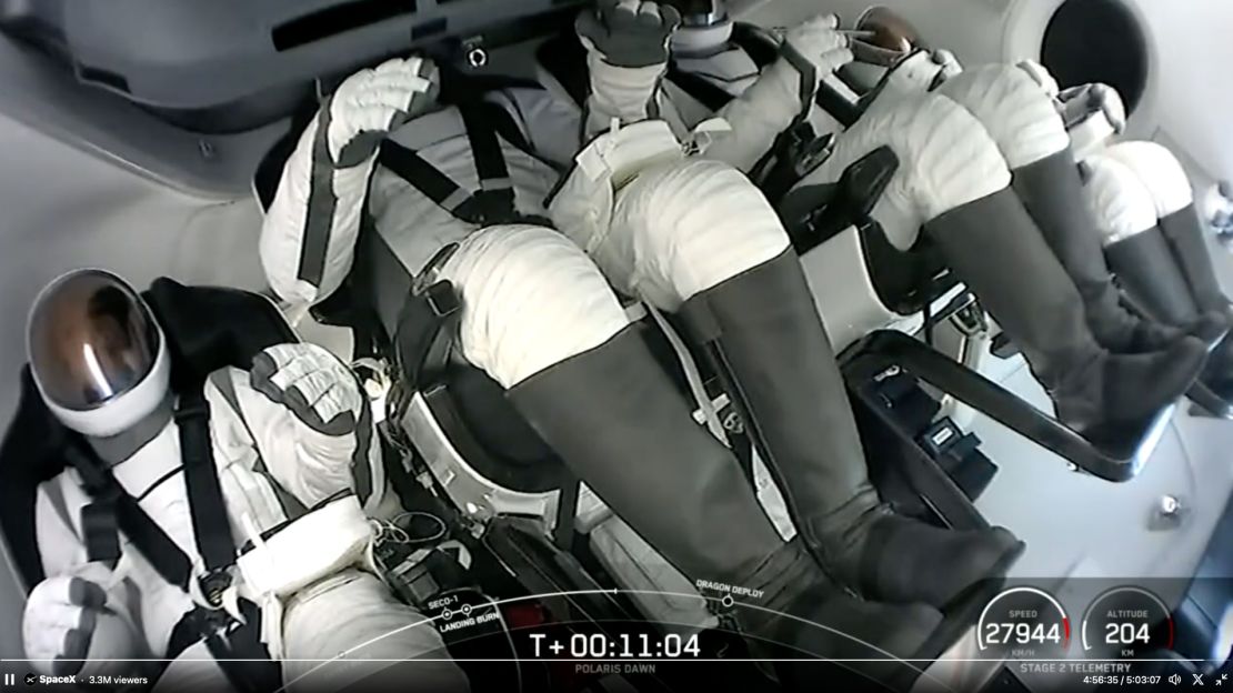 In this screenshot from the video, the Polaris Dawn crew sits inside the Dragon capsule shortly after launching into space on Tuesday.