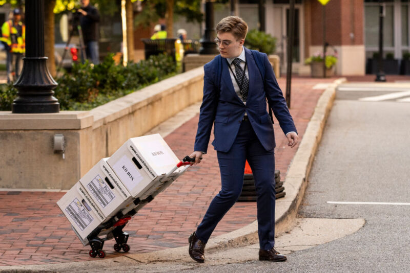 Paul Weiss, an employee of the law firm, drives boxes of legal documents into the Albert V. Bryan U.S. District Court at the start of the Justice Department's antitrust case against Google over its advertising business in Alexandria, Virginia, on September 9, 2024. Google is facing its second major antitrust case in less than a year, with the US government accusing the tech giant of manipulating online advertising competition and distorting it. 